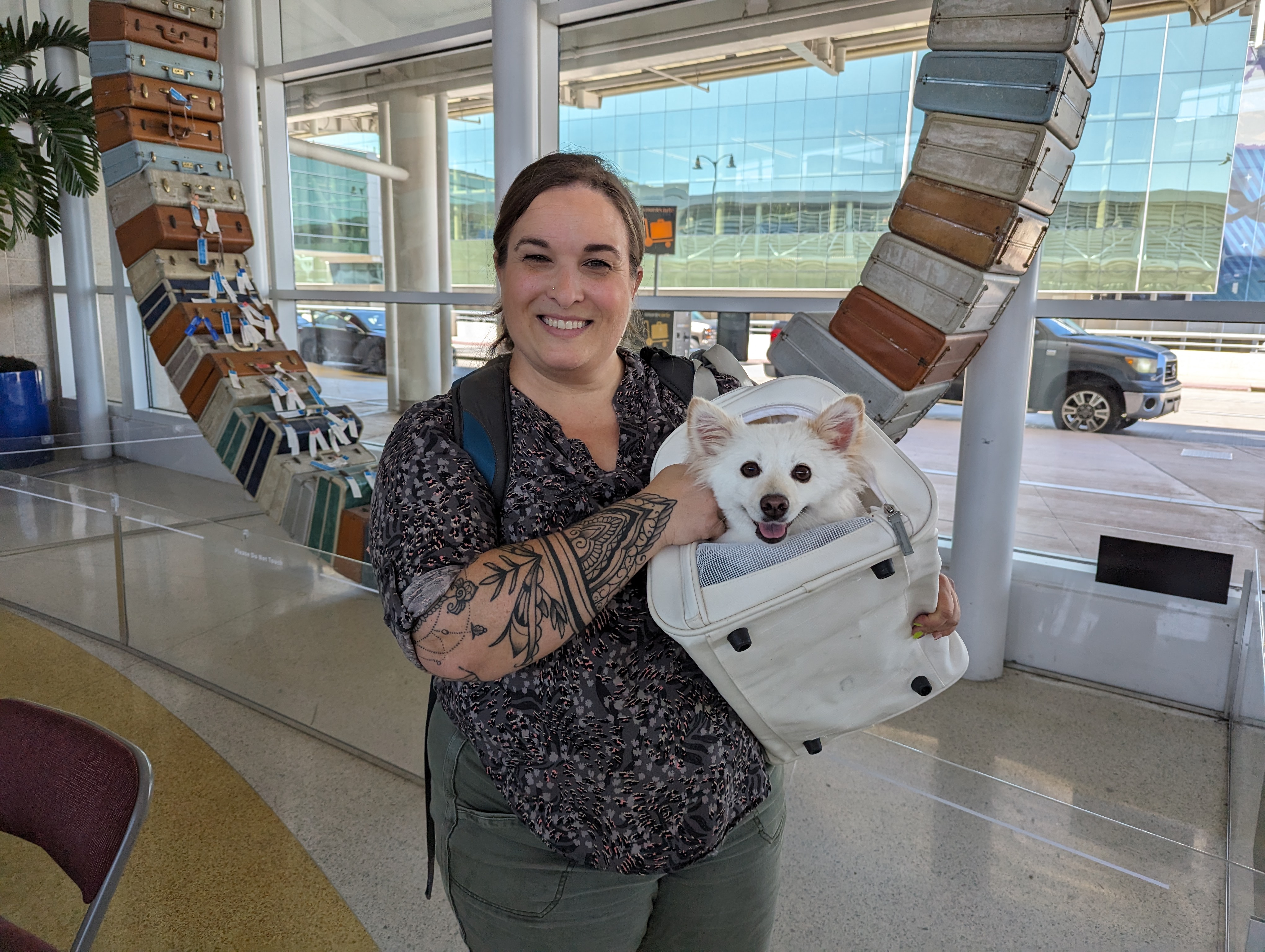 Traveler Stefanie Antosh travels through SAT with her dog, Zeita