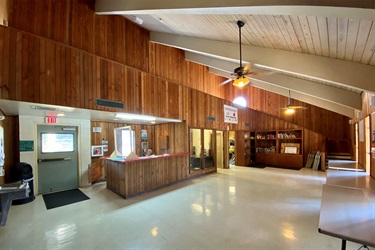 Inside a spacious room with elegant wood paneling, creating a warm and sophisticated ambiance.