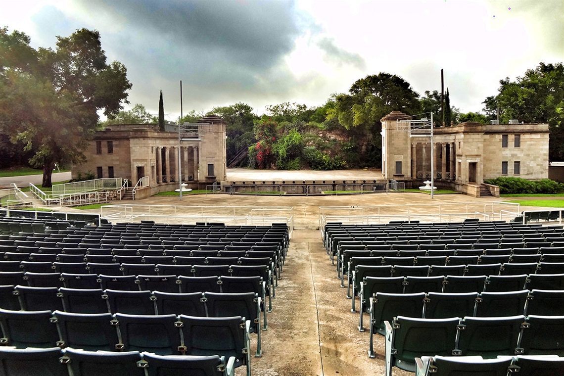 Performing Stage with rows of chairs in front and a pathway down the middle