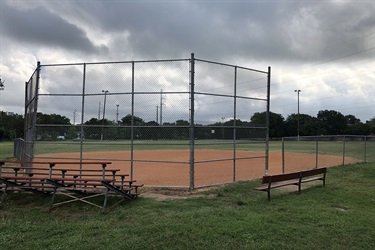 Kenwood Park bleachers, bench and baseball field