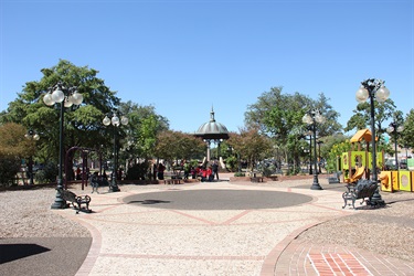 Park with gazebo, benches, and playground.