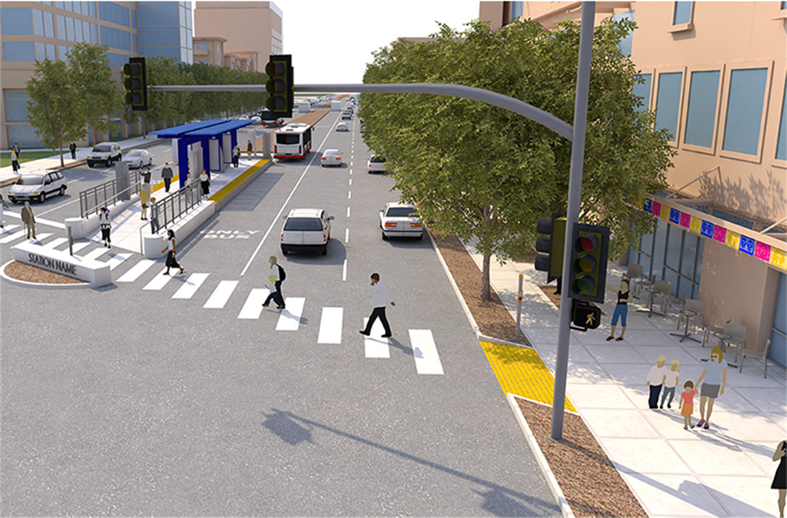 People walking in a crosswalk near a bus stop.