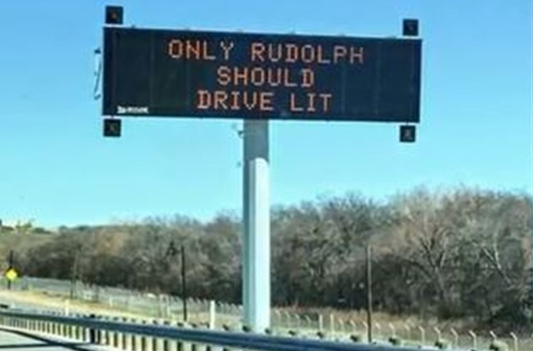 A TXDOT highway sign saying only Rudolph should drive lit. Photo by: Rebecca Flores